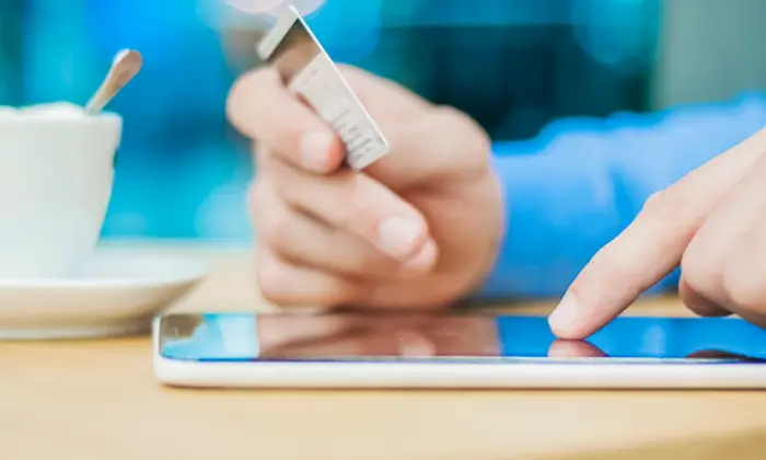 Man using card for online payment